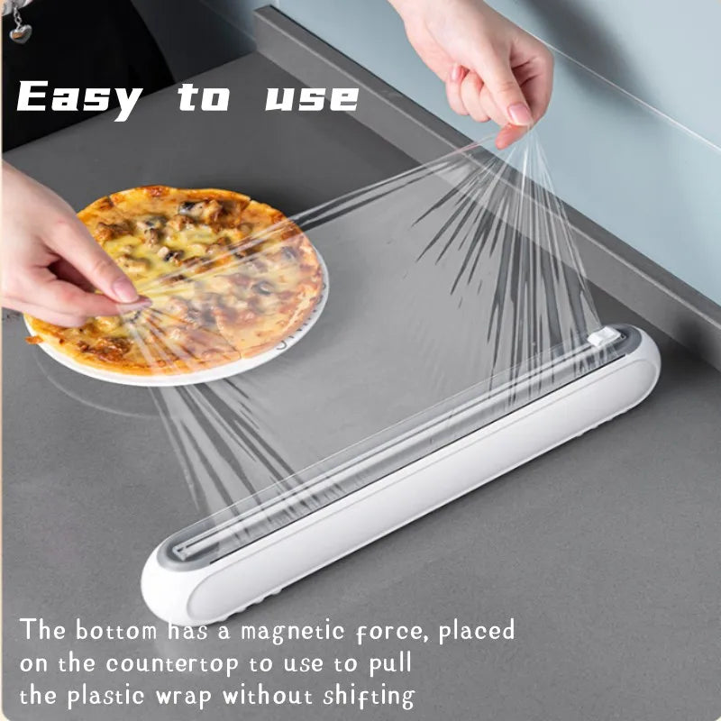 Porta pellicola trasparente per alimenti. Contenitore per pellicola trasparente con taglierina e magnete per montaggio.