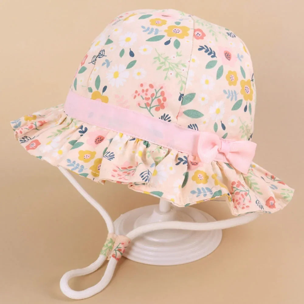 Cappello primavera/estate per bambino/a con immagini colorate. Protezione a 360° in cotone traspirante.