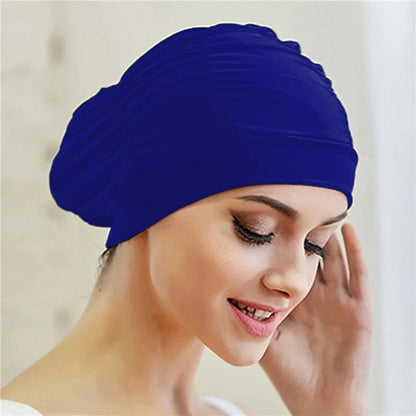 Cuffia da nuoto per donna adulta e bambina.  In nylon elastico con design per capelli lunghi.