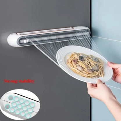 Porta pellicola trasparente per alimenti. Contenitore per pellicola  trasparente con taglierina e magnete per montaggio.