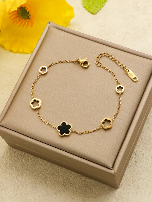 Bracciale in acciaio inossidabile color oro con fiore colorato. Unisex per donna.