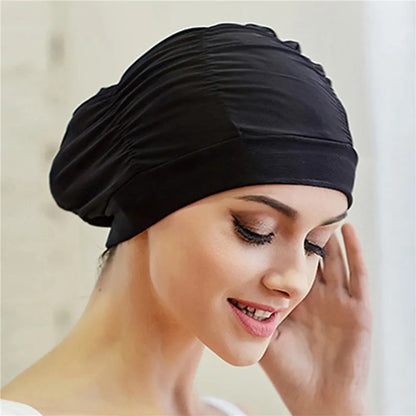 Cuffia da nuoto per donna adulta e bambina.  In nylon elastico con design per capelli lunghi.