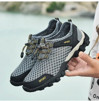 Scarpa sportiva primavera/estate da uomo, traspirante, morbida e resistente. Misura dal 39 al 44, disponibile grigia, blu e nera.