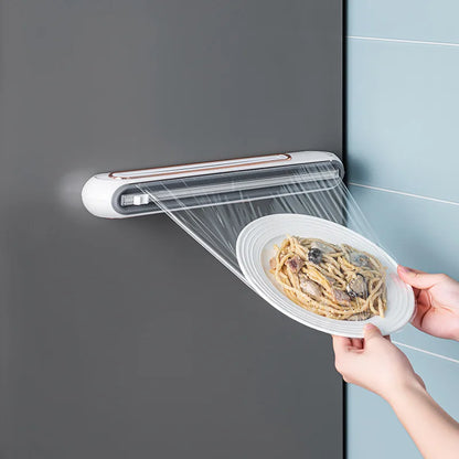 Porta pellicola trasparente per alimenti. Contenitore per pellicola  trasparente con taglierina e magnete per montaggio.