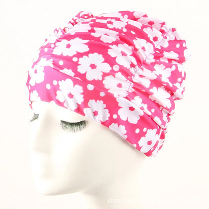 Cuffia da nuoto per donna adulta e bambina.  In nylon elastico con design per capelli lunghi.