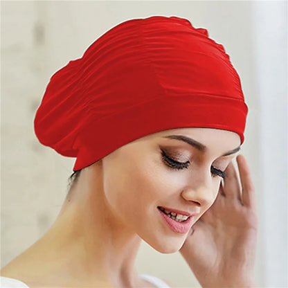 Cuffia da nuoto per donna adulta e bambina.  In nylon elastico con design per capelli lunghi.